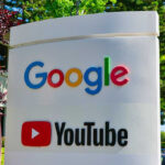 Google and YouTube sign with trees in background