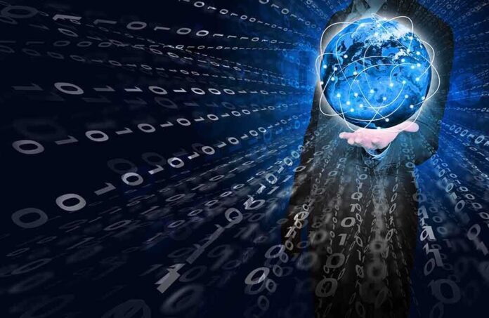 A businessman holding a glowing globe surrounded by binary code