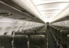 Empty airplane cabin with rows of seats