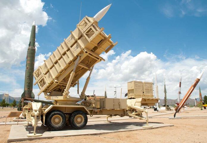 shutterstock_55040773.jpg Patriot missile defense system on display outdoors with various missiles in the background