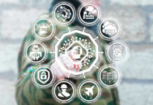 Person interacting with futuristic holographic interface and icons