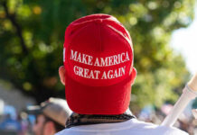 Person wearing a red Make America Great Again hat.