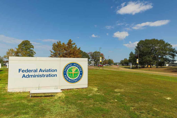 2370263441 Federal Aviation Administration sign on grassy lawn.