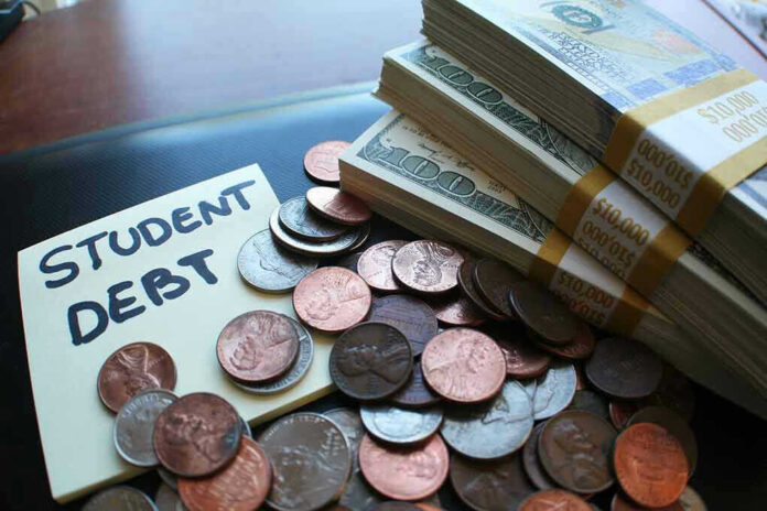 Note with student debt coins and banknotes
