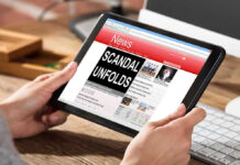 Person reading news headline Scandal Unfolds on tablet
