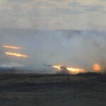 Putin BOMBS NATO Territory — Poland ATTACKED! A tank firing in a smoky battlefield during a military exercise