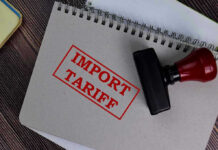 Notebook with Import Tariff stamp and rubber stamper.