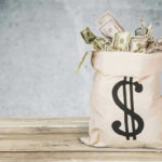 Snoop Dogg Drops Half-Million Bomb on Wales Bag of money with dollar sign.