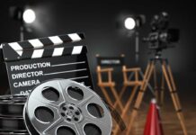 Film production equipment including a clapperboard, film reel, and directors chair