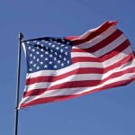 7 Years WAITING–American FLAG Flies AGAIN! Waving American flag against a clear blue sky