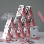 First Nation COLLAPSES Under Iran Oil Stranglehold A house of cards collapsing with some cards in motion