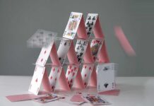 First Nation COLLAPSES Under Iran Oil Stranglehold A house of cards collapsing with some cards in motion