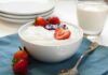 Death Threats Target YOGURT Shop A bowl of creamy dessert topped with fresh strawberries and a drizzle of jam
