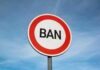 A road sign displaying the word 'BAN' against a blue sky