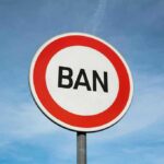 A road sign displaying the word 'BAN' against a blue sky
