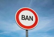 Government BANS Candidate Over Facebook Post A road sign displaying the word 'BAN' against a blue sky
