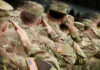 Europe Defense Shake-Up: Shocking Reality Check Soldiers in camouflage uniforms saluting in formation outdoors