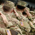 Europe Defense Shake-Up: Shocking Reality Check Soldiers in camouflage uniforms saluting in formation outdoors