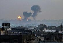 INTERNATIONAL INCIDENT: Chinese Ship Struck Near Odesa! Flames and smoke billowing over a cityscape.
