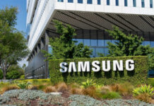 Samsung building with large sign and greenery.