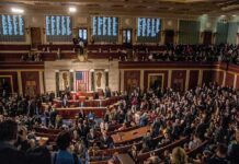 Entrenched Power Play Rocks the State A crowded congressional chamber with members in discussion