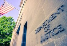 Exterior view of the Department of Justice building with an American flag