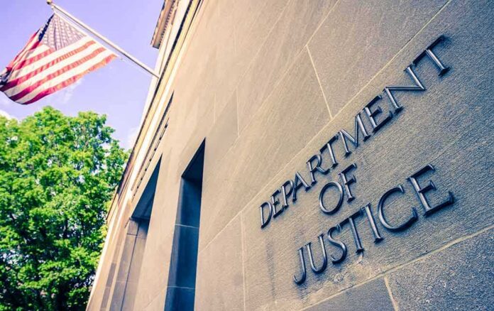 shutterstock_1384089728-2-1-2 Exterior view of the Department of Justice building with an American flag