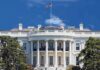 Trump–Brazil MEETING — What’s HIDDEN Behind Closed Doors? The White House with the American flag flying against a blue sky