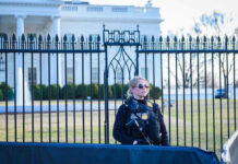 Mother’s Tip Foils White House UFC Plot Secret Service agent stands guard outside the White House.