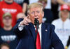 U.S. Leadership Remarks Ignite Backlash Man in suit pointing, speaking at a rally.