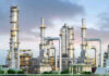 U.S. Iran Threats Over Oil Spark Global Shock Industrial plant with metal towers and pipes.