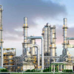 U.S. Iran Threats Over Oil Spark Global Shock Industrial plant with metal towers and pipes.