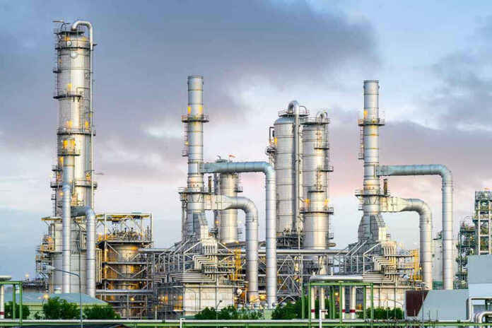 Industrial plant with metal towers and pipes.