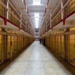 Political Prisoner Death Highlights Nicaragua’s Crackdown Long hallway with prison cells on both sides.