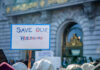 Sign reading Save Our Healthcare at protest.