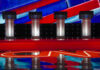 Four debate podiums on a CNN stage background.