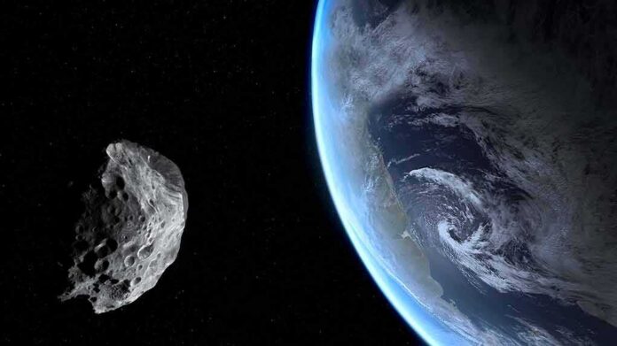 shutterstock_1006616230 Asteroid passing near Earth in space