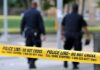 Southern California Teen Football Player Fatally Stabbed Police officers walking past caution tape at a crime scene