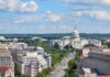 Tariffs. Antitrust. Industrial Policy: Rewriting Republican Economics United States Capitol building with city street and skyline