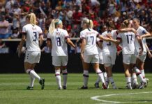 Halftime Hijack: FIFA Turns Final Into Concert women's soccer team celebrating on the field