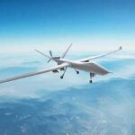Unmanned aerial drone flying over mountains