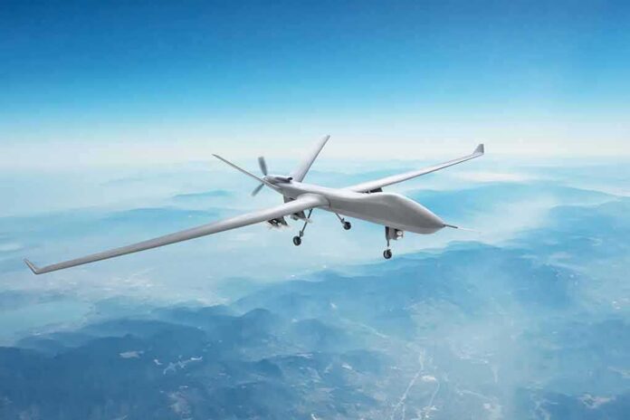shutterstock_2071157630 Unmanned aerial drone flying over mountains