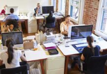 New Chinese AI Model Intensifies Competition Open plan office with people working at desks