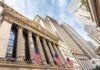 New York Stock Exchange facade with columns and American flags