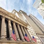 New York Stock Exchange facade with columns and American flags