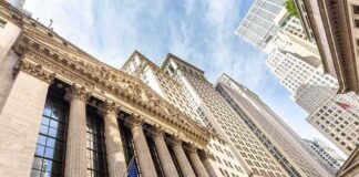 New York Stock Exchange facade with columns and American flags