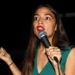 Socialist Leader’s $1.5M Home Raises Eyebrows Woman speaking into a microphone on stage