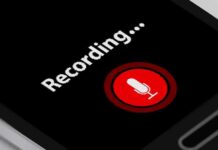 smartphone screen showing a red microphone recording button