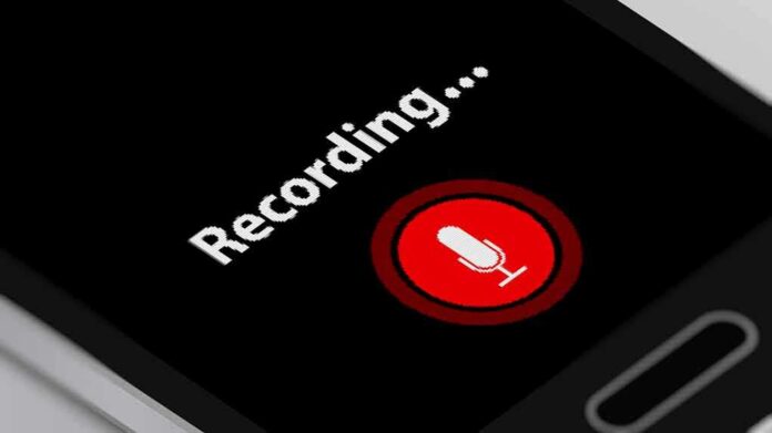 smartphone screen showing a red microphone recording button