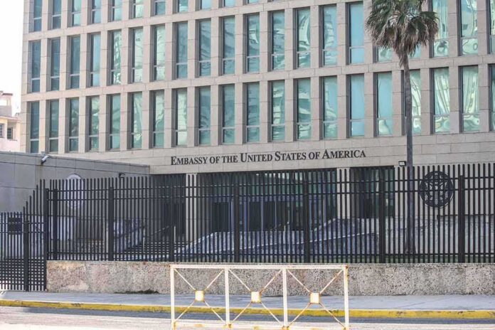 shutterstock_1830525032 Embassy building behind tall black security fence
